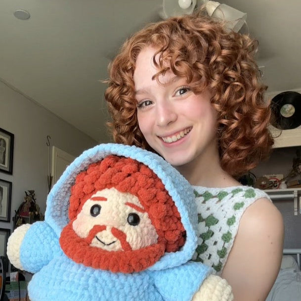 Jasmin holding her crochet CaseOh plushie